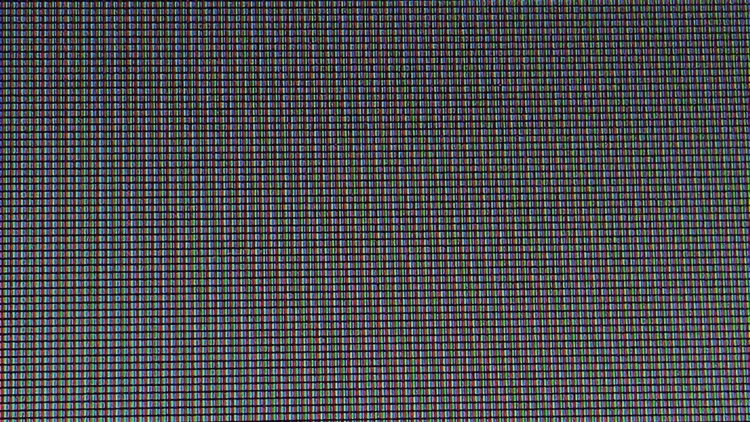 Color grading wheels displayed on a monitor screen