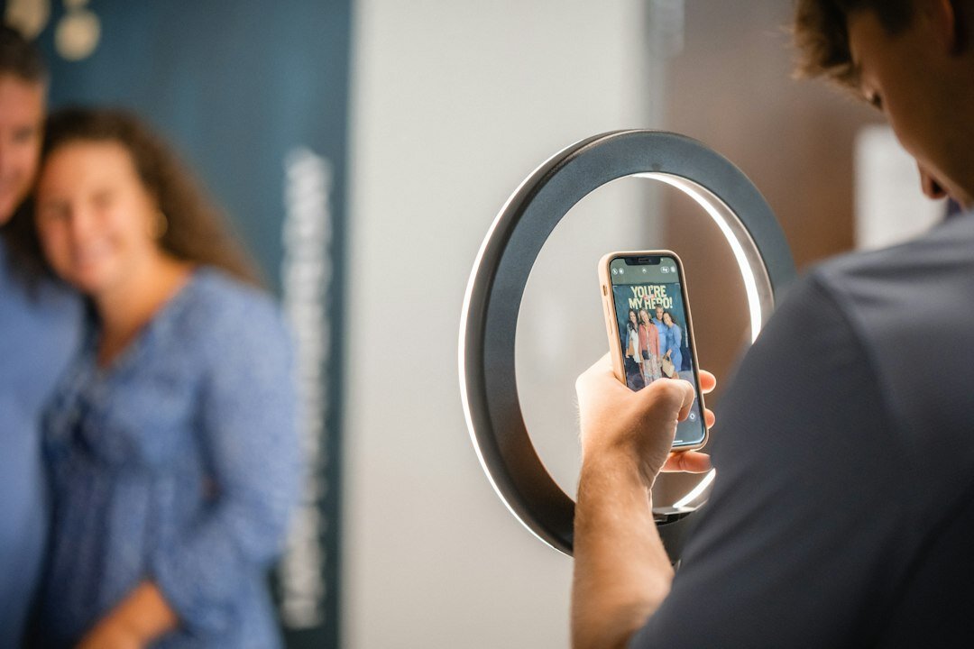 Young influencer taking a selfie video with ring light