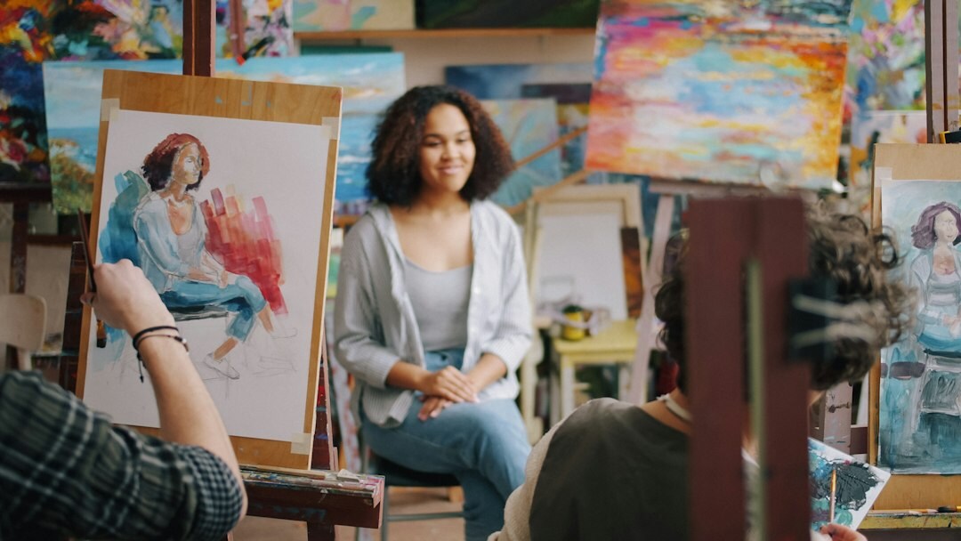Group of students and mentors in a bright creative studio