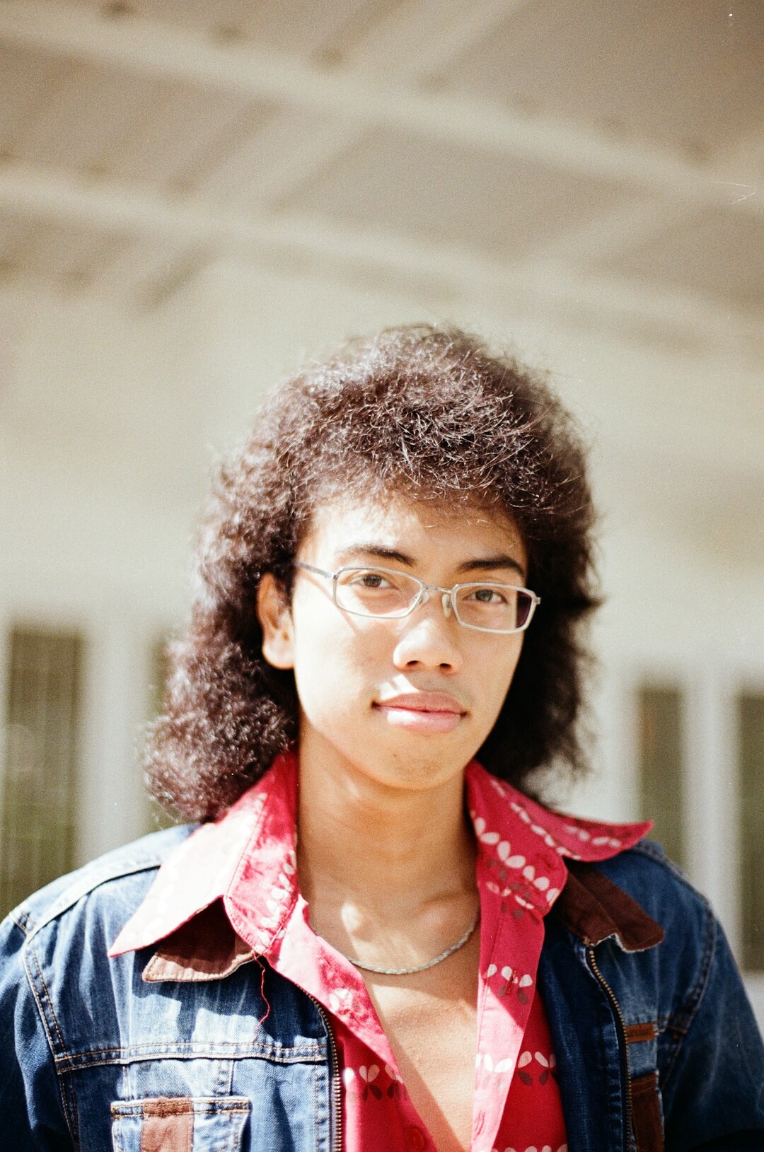 Portrait of a young female student with curly hair
