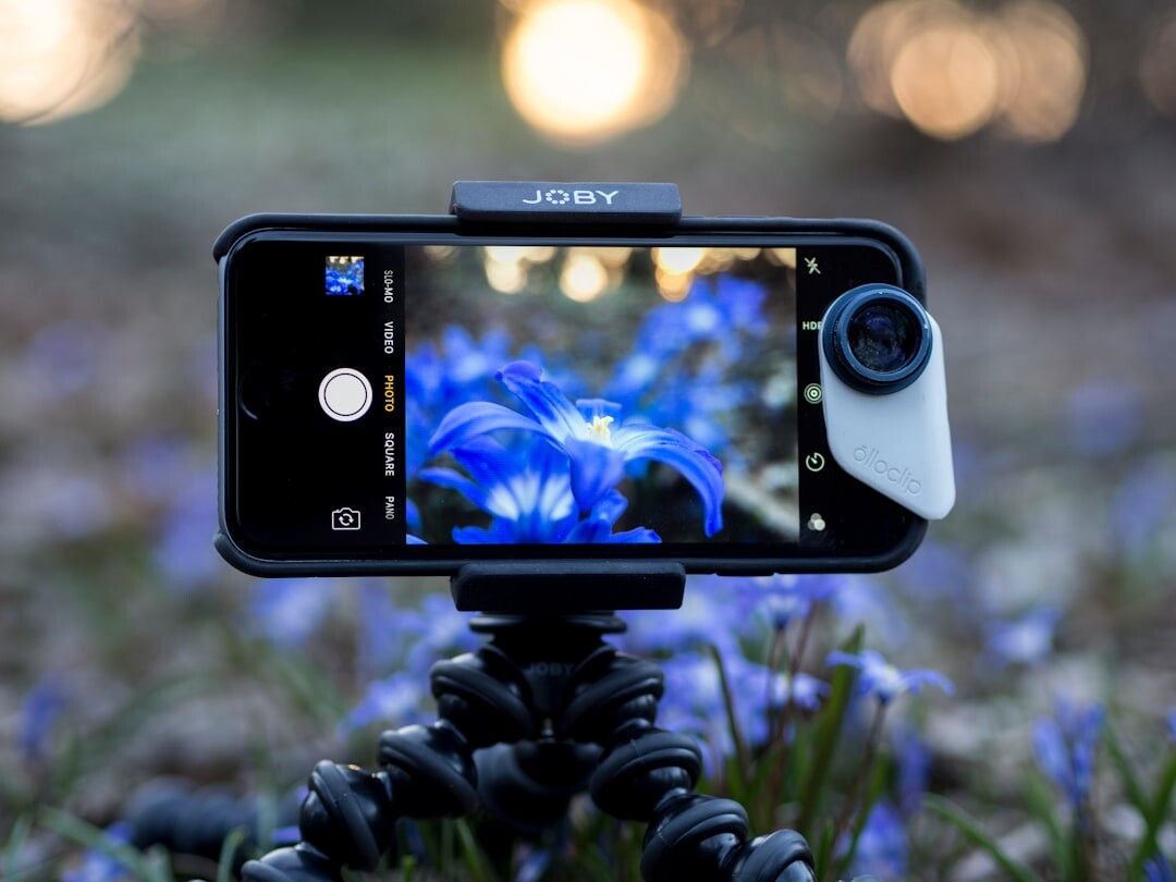 Smartphone mounted on tripod with ring light for filming